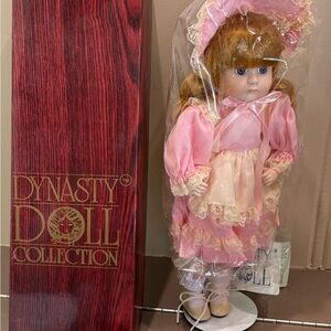 Dynasty Doll Collection Pink Porcelain Doll with Bonnet